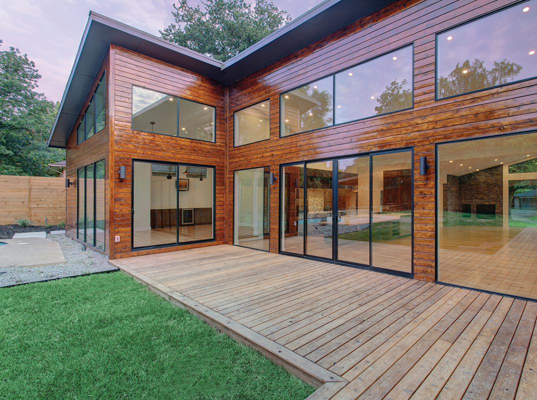 Milgard patio doors on a wooden house with deck