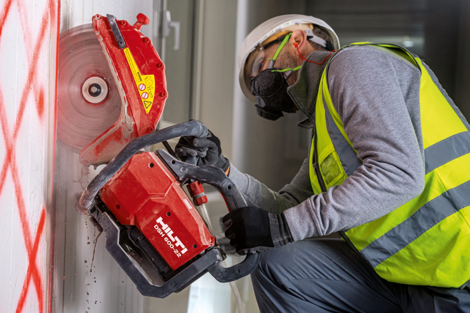 worker using hand saw